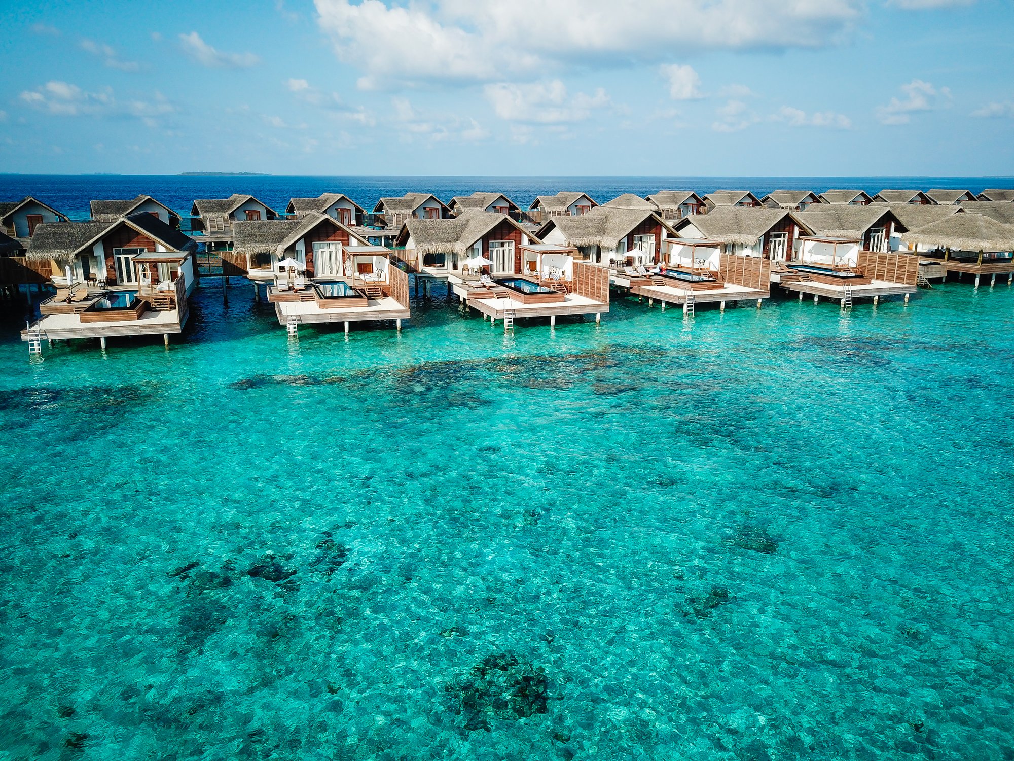 Fairmont Maldives Sirru Fen Fushi — Aerial view of the water villas