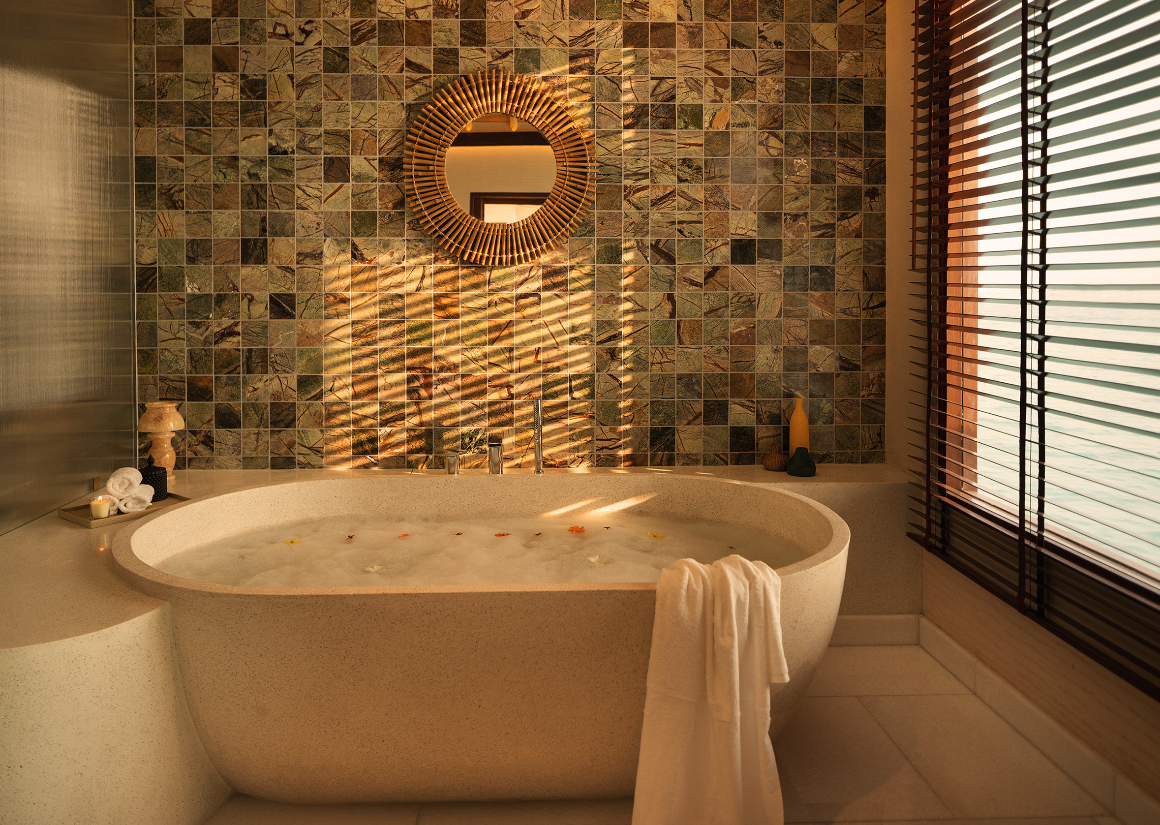 Rah Gili Maldives — Water pool villa exterior over the lagoon