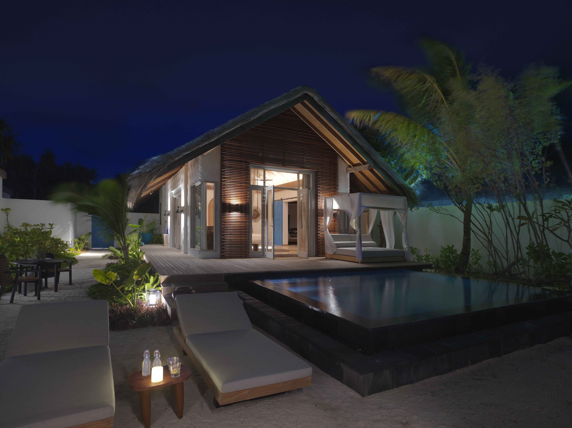 Fairmont Maldives Sirru Fen Fushi — Beach villa at sunset